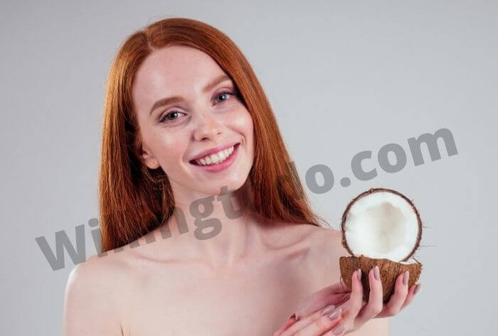 Female is showing to make lip gloss with coconut oil