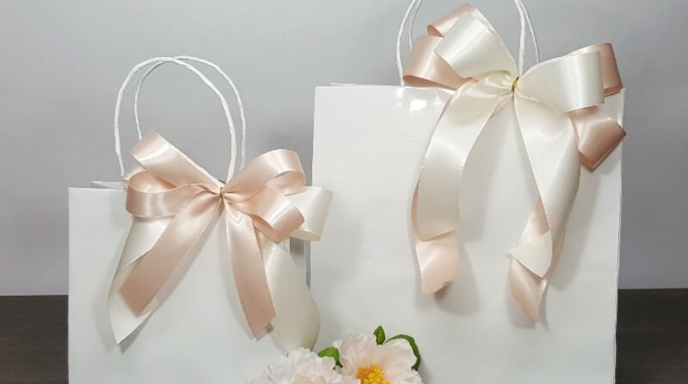 Double bow on gift bags for Christmas