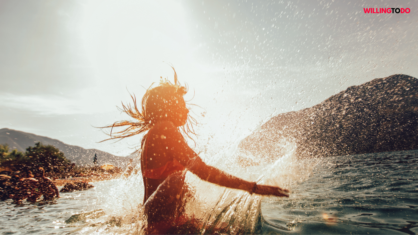 women take a bath in the river in sunlight