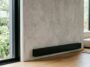 A electric baseboard heater installed in a living room showing clean electric baseboard heaters properly for better efficiency and home safety.