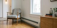 A clean baseboard heaters in a modern living room.