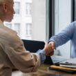 Professionals discussing contract for gratuity in UAE