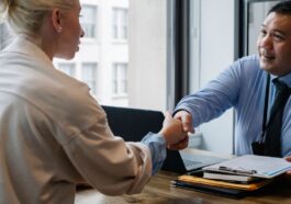 Professionals discussing contract for gratuity in UAE
