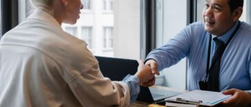 Professionals discussing contract for gratuity in UAE